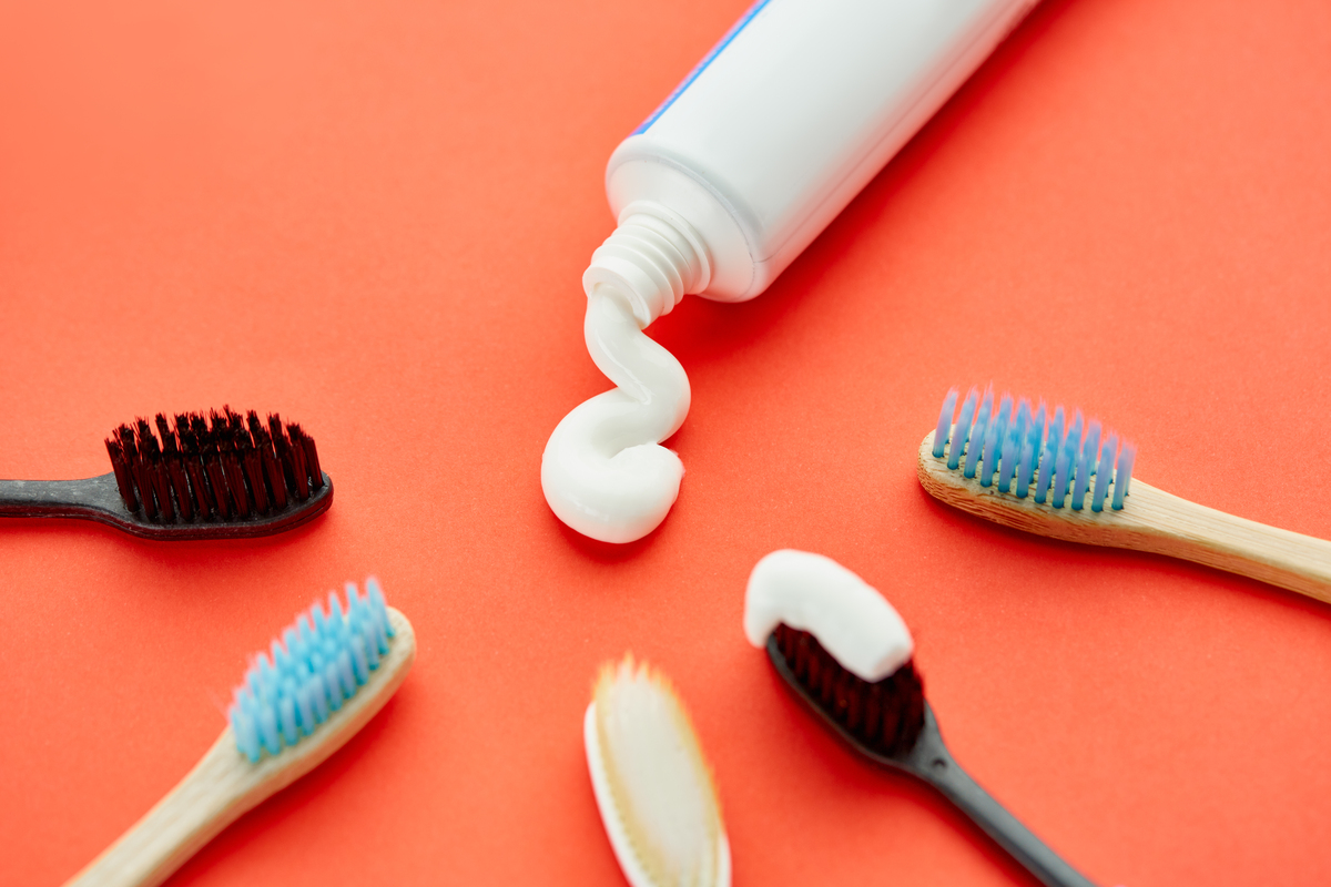 An image of a toothbrush and toothpaste.